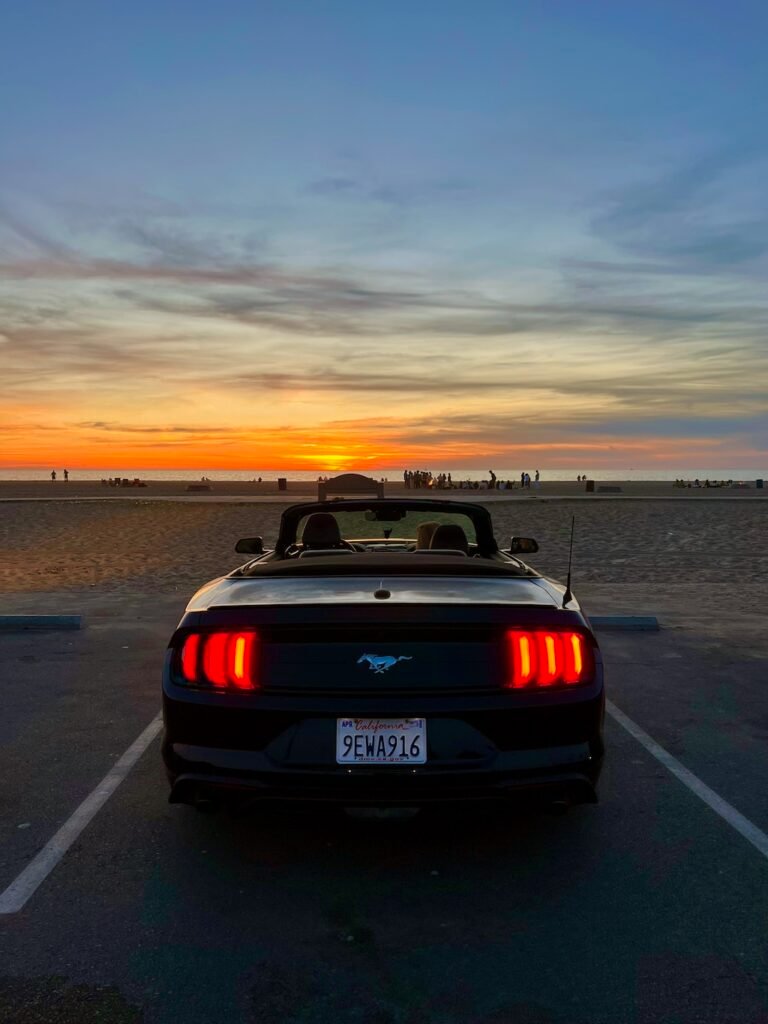 One last Californian sunset: our hire car parked on the beach at the end of the Los Angeles runways